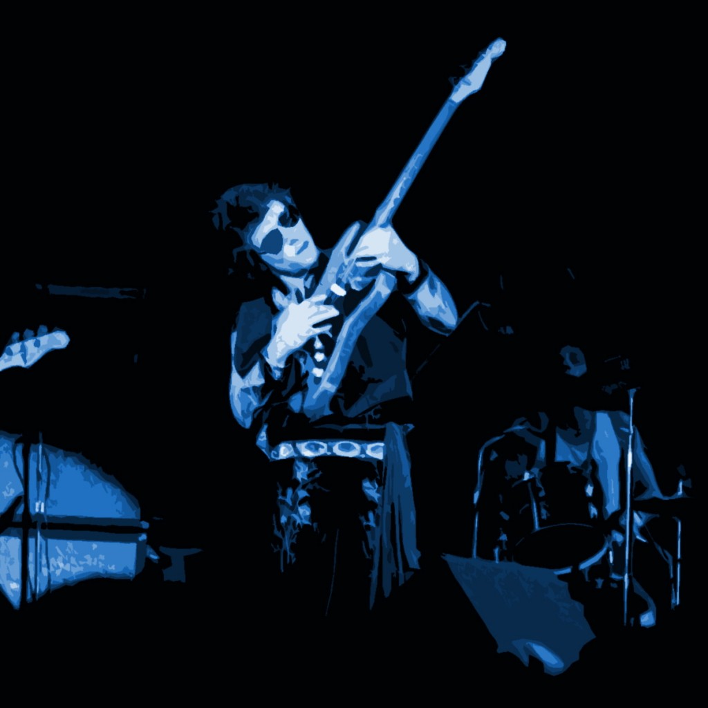 NILS LOFGREN NILS LOFGREN PERFORMING LIVE AT WINTERLAND ON 10-11-75. PHOTO BY BEN UPHAM. MAGICAL MOMENT PHOTOS.